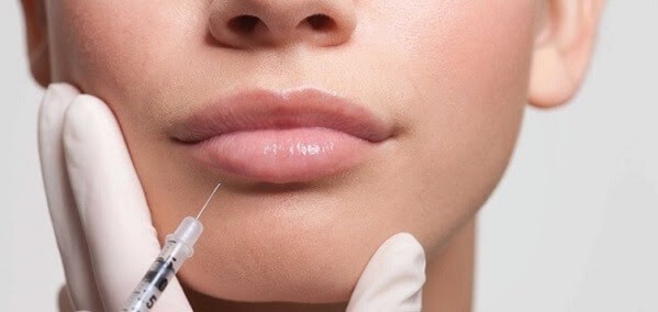 Fillers injections help lips stretch seductively